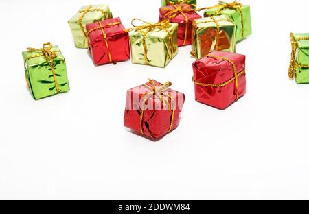 top view of arranged wrapped christmas gift boxes with ribbons on white backgrounds Stock Photo