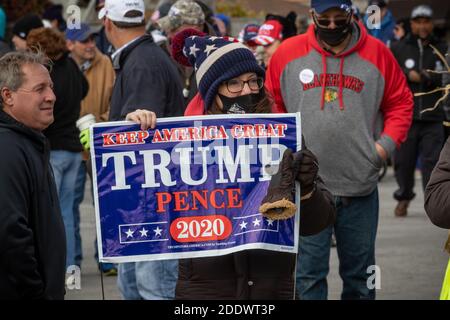 Pro Trump rally at a country music bar in Chicago's far south side Mount Greenwood neighborhood on the Sunday before Election Day. The outdoor rally was held in a parking lot next to the bar and along 111th street, a busy thouroghfare in the neighborhood. Stock Photo