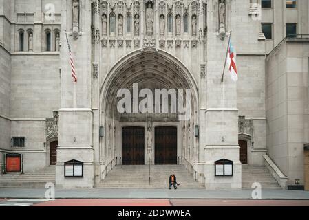 June 05, 2020. Manhattan, New York, Usa. A homeless man begs for money on the steps of St. Thomas Church on an empty fifth avenue in Midtown. Stock Photo