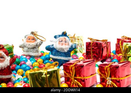 Santa Claus with colorful balls and Gift boxes on white backgrounds Stock Photo