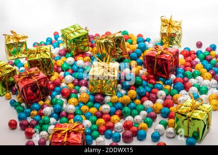 Gift boxes with colorful balls on white backgrounds Stock Photo