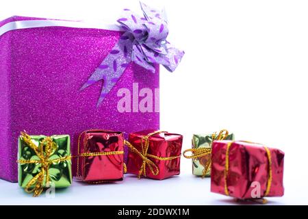Christmas gift box. Christmas presents in Multi-colored boxes isolated on a white backgrounds Stock Photo