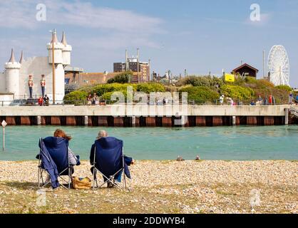 Two people in deckchairs on the River Arun, Littlehampton, West Sussex,  UK Stock Photo