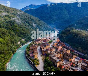 (201127) -- KUNMING, Nov. 27, 2020 (Xinhua) -- Aerial photo taken on Oct. 31, 2020 shows a view of Dulongjiang Township of Gongshan Dulong and Nu Autonomous County, southwest China's Yunnan Province. Dulong is a mountain-dwelling ethnic group in southwest China. It is one of the least populous of China's 56 minority nationalities. It is also called a 'direct-transition' minority ethnic group because the Dulong people didn't bid farewell to primitive life until the founding of the People's Republic of China in 1949 and since then they directly stepped into the socialist society. Most Dulong Stock Photo