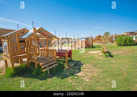 Large wooden climbing frame structure in children's playground area of luxury hotel resort Stock Photo