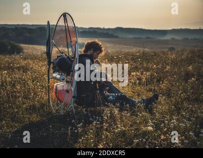 Paragliding in the mountains, paraglider on the ground. Stock Photo