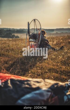 Paragliding in the mountains, paraglider on the ground. Stock Photo