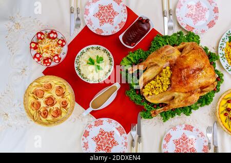 Christmas or New Year dinner with roasted turkey and traditional dishes. Top view. Stock Photo