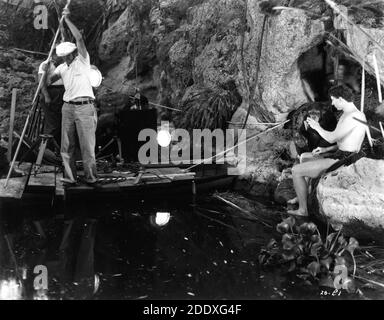 Olympics Athlete GLENN MORRIS on set candid with Chimpanzee during filming of his only appearance as Tarzan in TARZAN'S REVENGE 1938 director D. ROSS LEDERMAN based on a novel by Edgar Rice Burroughs Sol Lesser Productions / Twentieth Century Fox Stock Photo