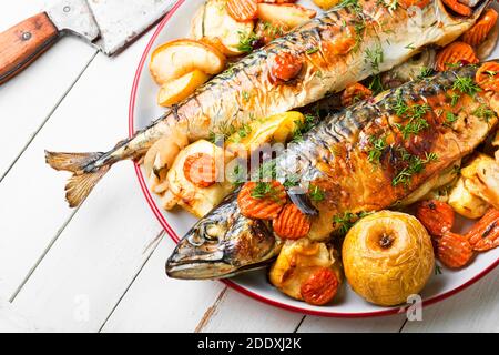 Delicious mackerel or scomber in apples.Roasted fish Stock Photo
