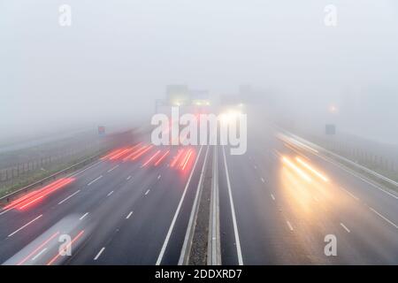Bar Hill Cambridgeshire, UK. 27th Nov, 2020. Drivers on the A14 dual carriageway road near Cambridge faced freezing fog and poor visibility today. Foggy weather blanketed much of the east of England this morning and is forecast to continue most of the day. Credit: Julian Eales/Alamy Live News Stock Photo