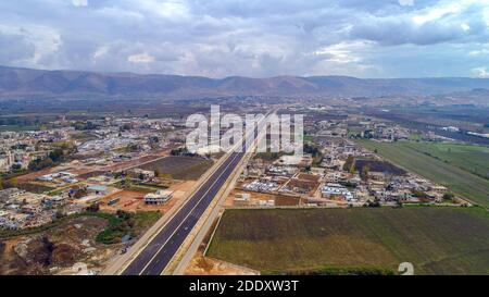 Aerial View of Lebanese Country side Village with new high way and Magical sunset sky Stock Photo