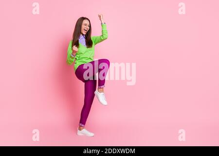 Full size photo of ecstatic girl win raise fists scream isolated over pink color background Stock Photo