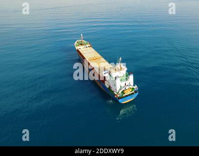 Cargo ship in Ocean high angle aerial shot Stock Photo