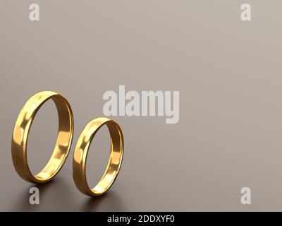 Two wedding gold rings lie next to each other on grey background. 3d rendering Stock Photo