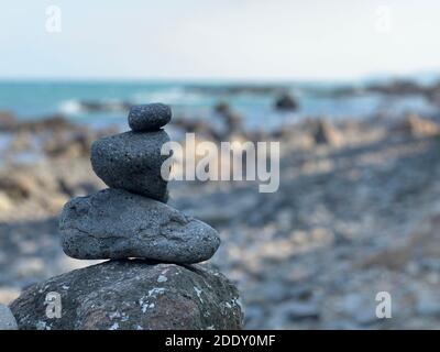 Zen stack of pebbles on the beach Stock Photo