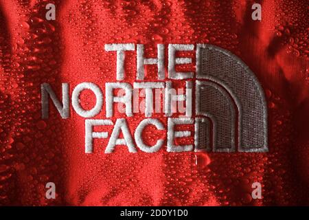 Zaragoza, Spain - October 21, 2021: Logo of the mountain sports brand, known as The North Face, sewn on a rain jacket. Stock Photo
