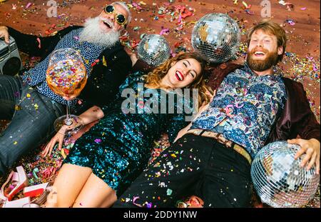 Happy party people with different age having fun celebrating holidays new year's eve Stock Photo