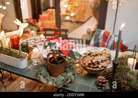 Beautifully decorated dinner table on the terrace outdoors during the New Year holidays Stock Photo