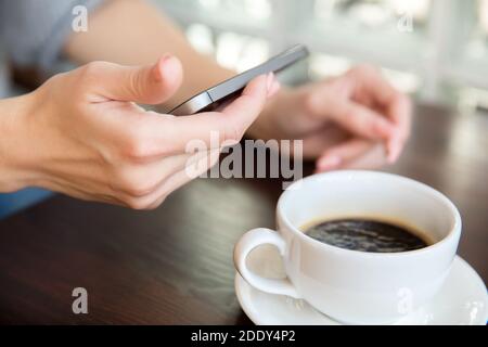 Female hands holding smartphone. Business women day concept. Stock Photo