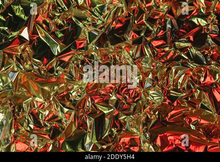 Aluminum background, silver foil metal with uneven and warped shiny surface Stock Photo
