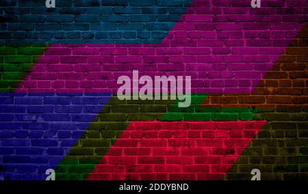 Brick wall painted with multi-colored paints. Abstract background. The old wall. Stock Photo