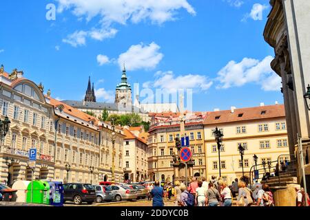 Czech Republic, Prague, 23.06.2012. People and tourist walking around the ancient and old style buildings in Prague with blue sky background. Stock Photo