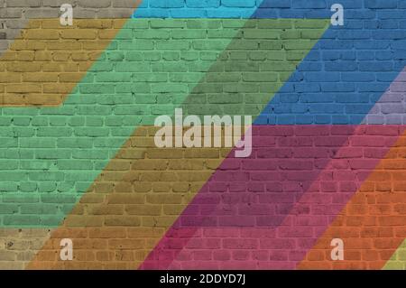 Brick wall painted with multi-colored paints. Abstract background. The old wall. Stock Photo