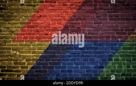 Brick wall painted with multi-colored paints. Abstract background. The old wall. Stock Photo