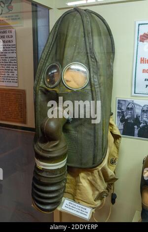 A special gas mask for the elderly or those with head injuries on display in the Thorpe Camp Visitor Centre,  Lincolnshire, UK. Stock Photo