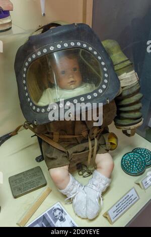 A baby's gas hood/mask on display in the Thorpe Camp Visitor Centre, a WWII Royal Air Force barracks, Lincolnshire, UK. Stock Photo