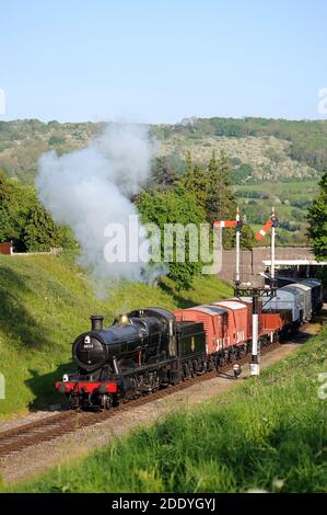 '3850' leaving Winchcombe with a goods train and heading towards Greet Tunnel. Stock Photo