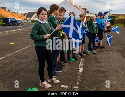 Athelstaneford, East Lothian, Scotland, United Kingdom, 27 November 2020. Saltire Festival: the birthplace of the Scottish national flag to mark the Saltire Festival leading up to St Andrew’s Day. Children from the Athelstaneford primary school celebrate their connection to the National Flag Heritage Centre with readings led by P7 children Stock Photo