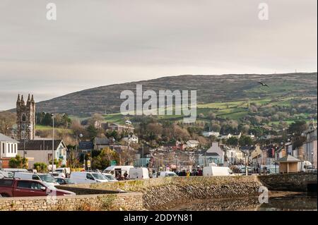 Bantry, West Cork, Ireland. 27th Nov, 2020. After the Met Eireann Yellow Fog Warning lifted late this morning, the sun made an appearance over Bantry Friday Market, which was well attended by both traders and shoppers alike. Credit: AG News/Alamy Live News Stock Photo