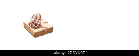 hand holding christmas gift on white background isolate, banner, copy space Stock Photo