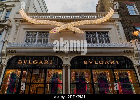 London, UK. 26th Nov, 2020. Closed luxury retailers in New Bond Street and Regent street do not appear to need to promote Black Friday and Christmas sales. People are still out in central london, despite the new lockdown which is now in force. The Christmas lights are on but the shops are shut. Credit: Guy Bell/Alamy Live News Stock Photo