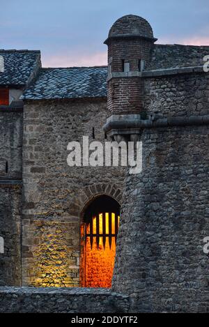 Dusk view of the exterior ramparts of the medieval village of Villefranche-de-Conflent, in the Occitanie region of southern France. Stock Photo