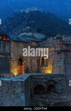 Dusk view of the exterior ramparts of the medieval village of Villefranche-de-Conflent, in the Occitanie region of southern France. Stock Photo