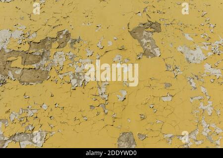 Texture of old cracked yellow painted wall of abandoned building , grunge background Stock Photo