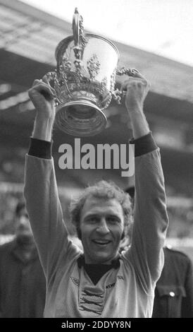 File photo dated 02-03-1974 of Wolves captain Mike Bailey holds the League Cup trophy aloft. Stock Photo