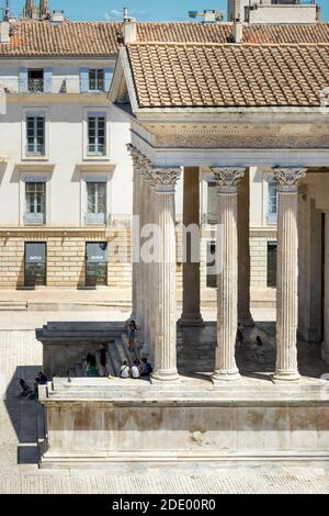 Nimes (south-eastern France): the Roman temple “Maison Carree” (Square House) viewed from the terrace of the “Ciel de Nimes” restaurant. Roman temple, Stock Photo