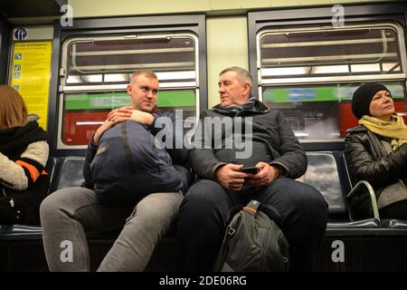 people in the downtown Metro bus in Mialn, Italy Stock Photo