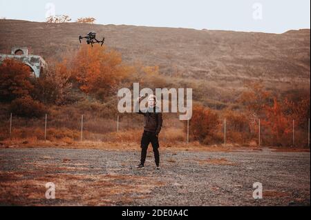 Stylish young man shoot drone at the phone Stock Photo