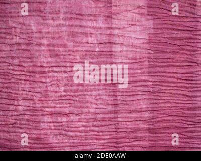 textile background from pink wrinkled silk fabric close up Stock Photo