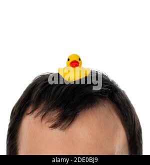 Yellow inflatable duck on head symbol of the Thai protests names rubber duck revolution Stock Photo