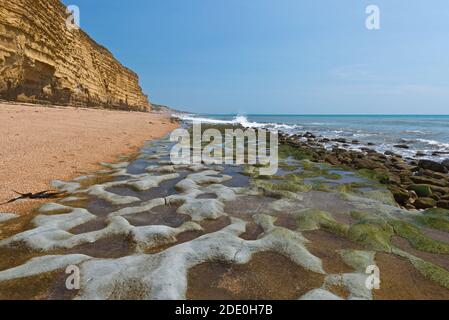 A view along the Jurassic Coast on the Dorset Coast in front of Burton Cliff close to Burton Bradstock. Part of the South West Coast Path. Stock Photo