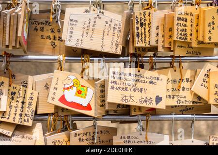 Japanese wooden prayer tablets called ema at the Bentendo Temple at the Shinobazu Pond in Tokyo, Japan Stock Photo