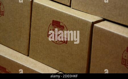 Free delivery stamp printed on cardboard box. Gratis shipping, service and package transport concept. Stock Photo