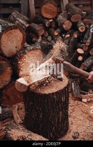 Wood shatters into pieces after ax chop Stock Photo