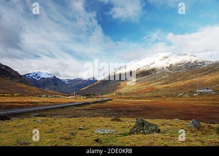Shown here is the A5 road running through the Nant y Benglog valley in Snowdonia towards the Carneddau and Glyderau mountain ranges. Stock Photo